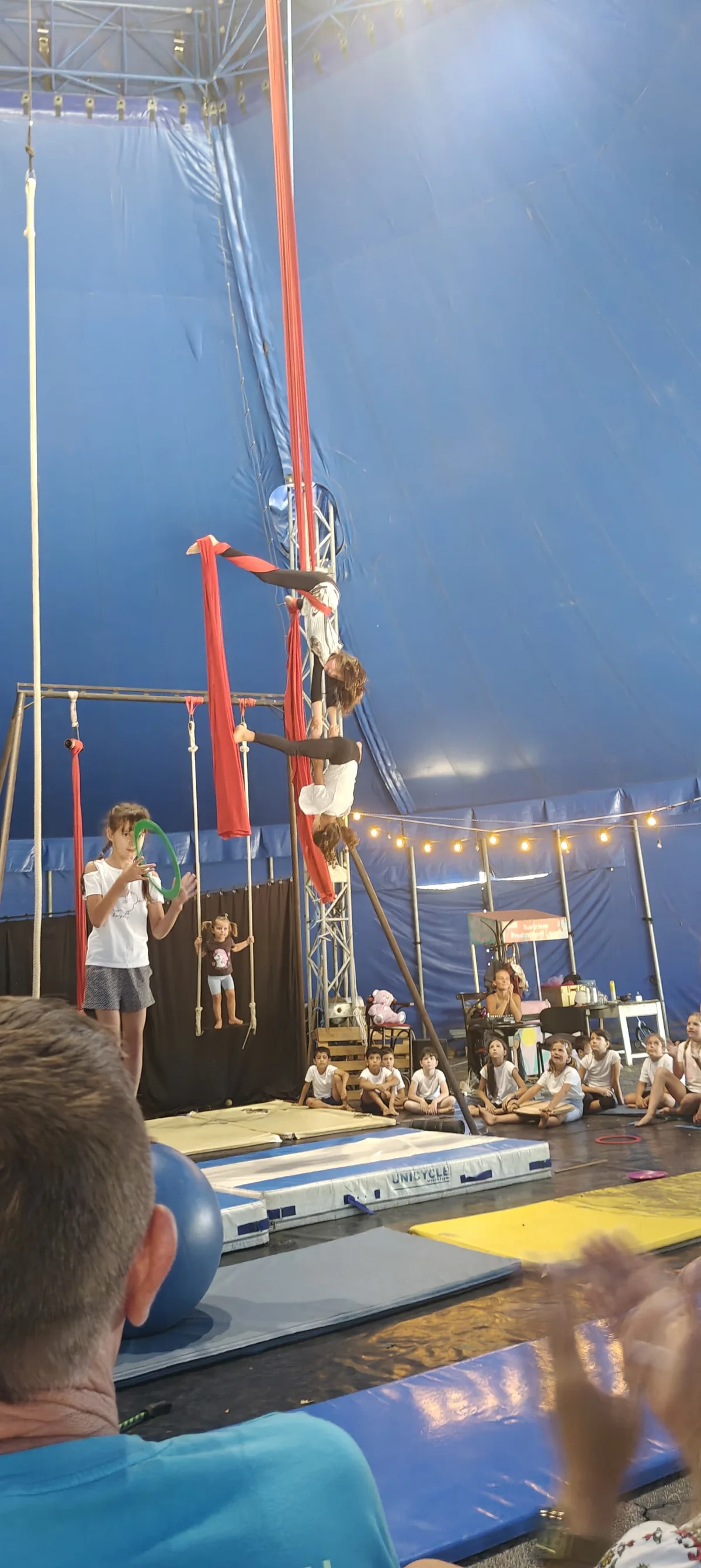 Full-height split figure on white silks